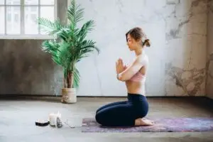 Woman practicing meditation for stress relief and blood pressure control